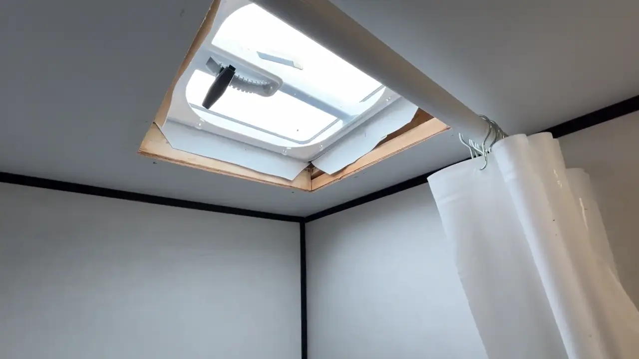 Bathroom roof vent in a Coleman 17B with the interior trim removed during a leak repair
