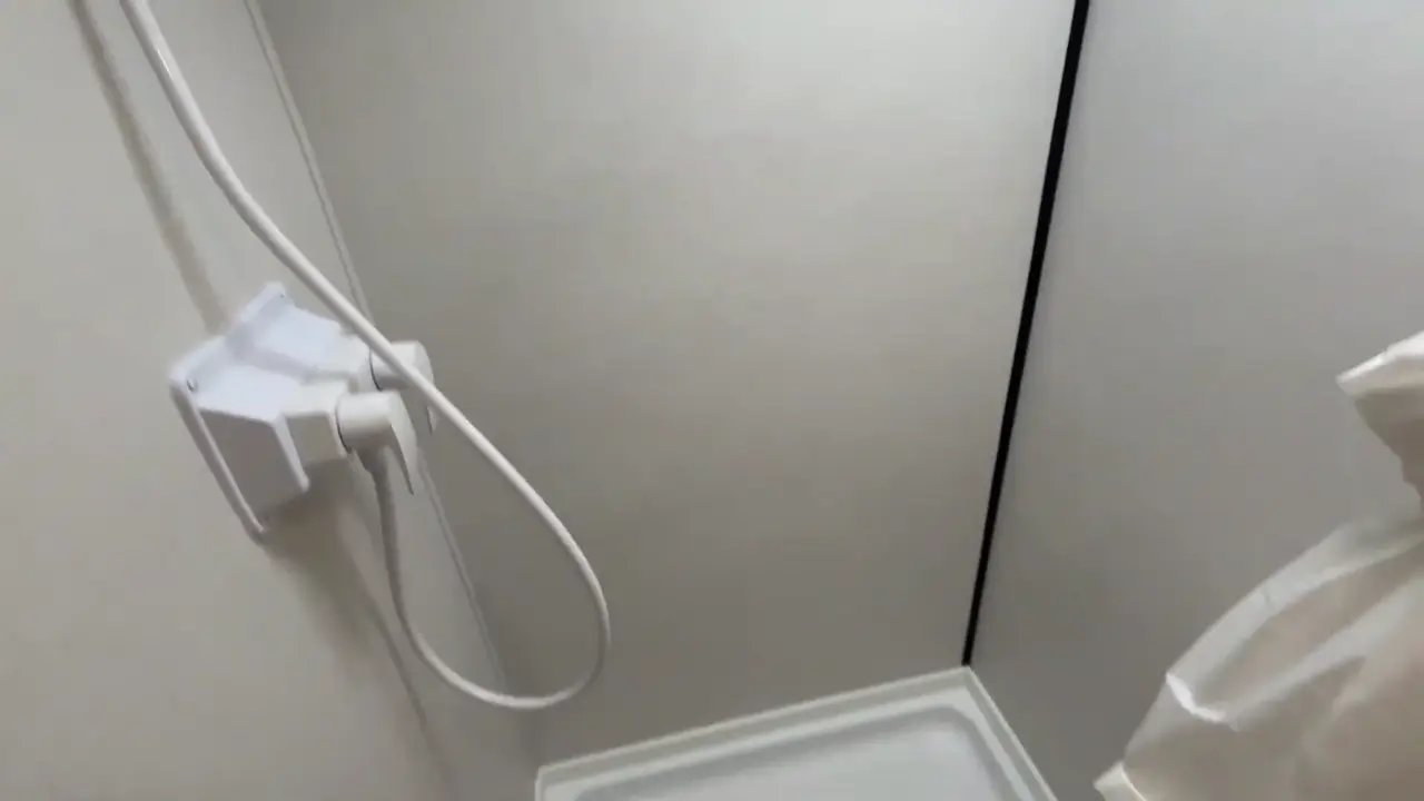 Shower walls and the corner of the shower pan in a Coleman 17B wet bath