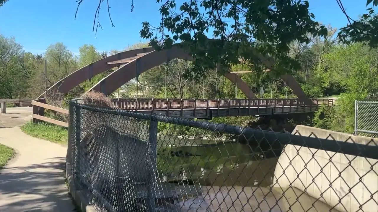 Arched steel footbridge on the walking trail at Fontana County Park
