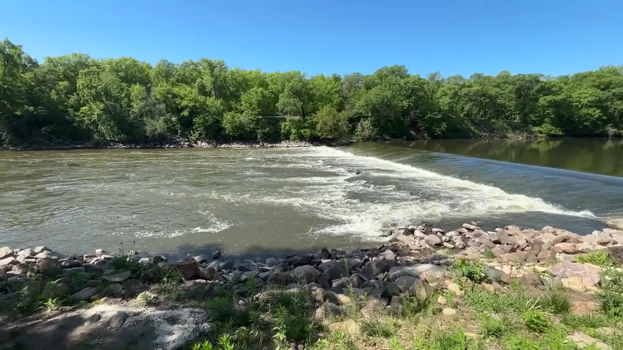 Water rushing over the low dam on the Shell Rock River at Heery Woods State Park