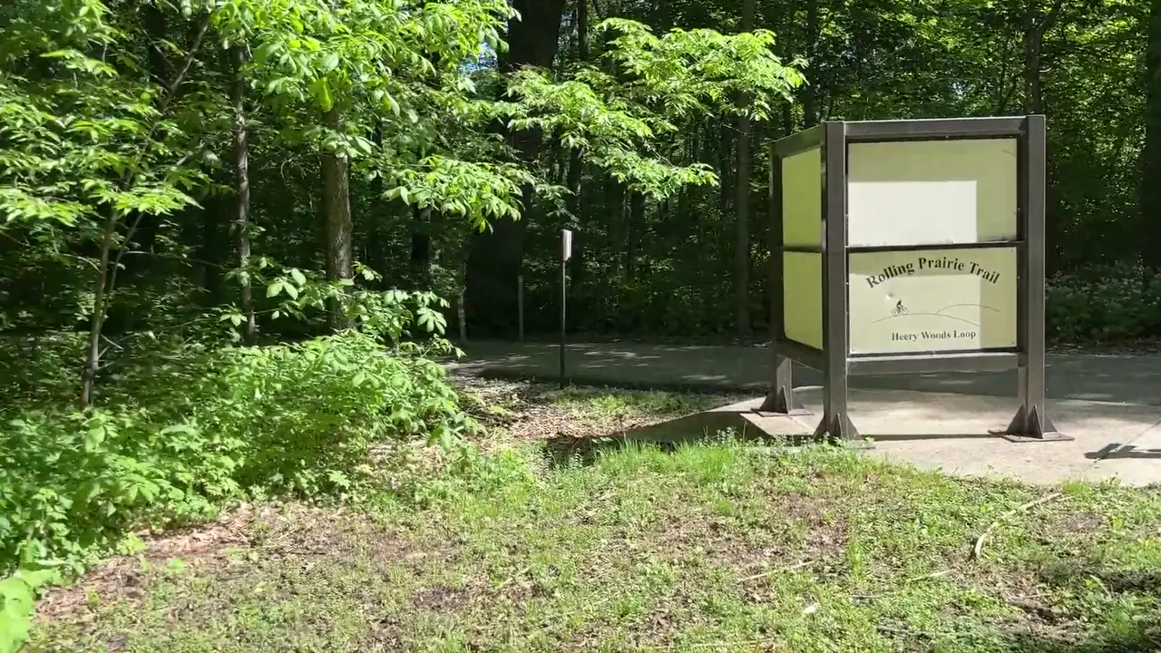 Wooded trailhead sign for the Rolling Prairie Trail at Heery Woods State Park