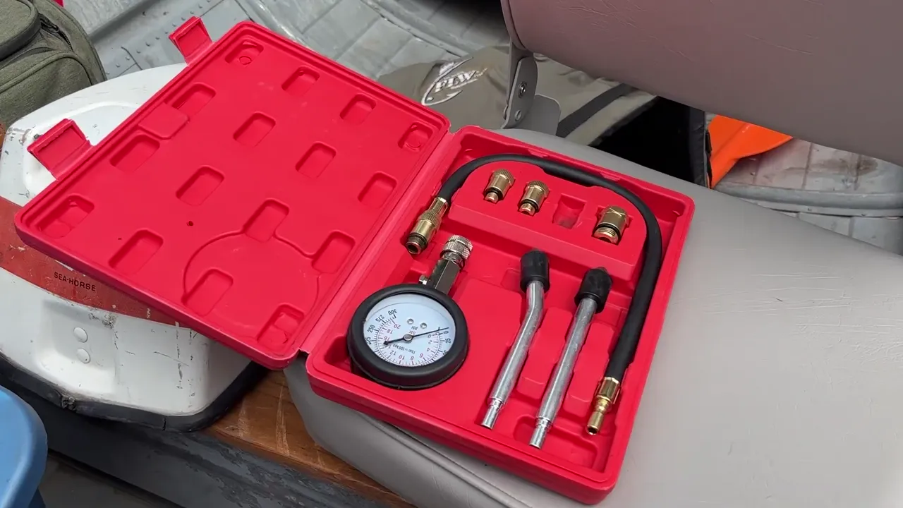 A compression tester kit for small engines and outboard motors