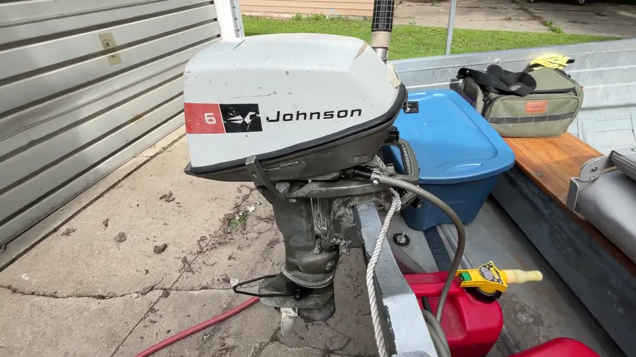 A 1972 Johnson 6 horsepower outboard motor mounted on a 1961 Sea King aluminum boat