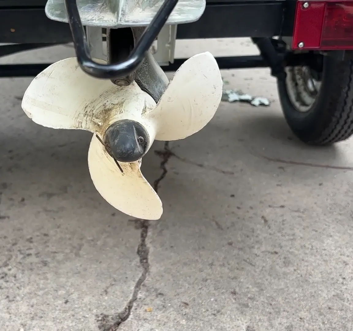 Checking the propeller on a used 1972 Johnson outboard