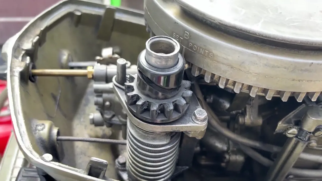 Under the cowl of a 1972 Johnson 6HP outboard
