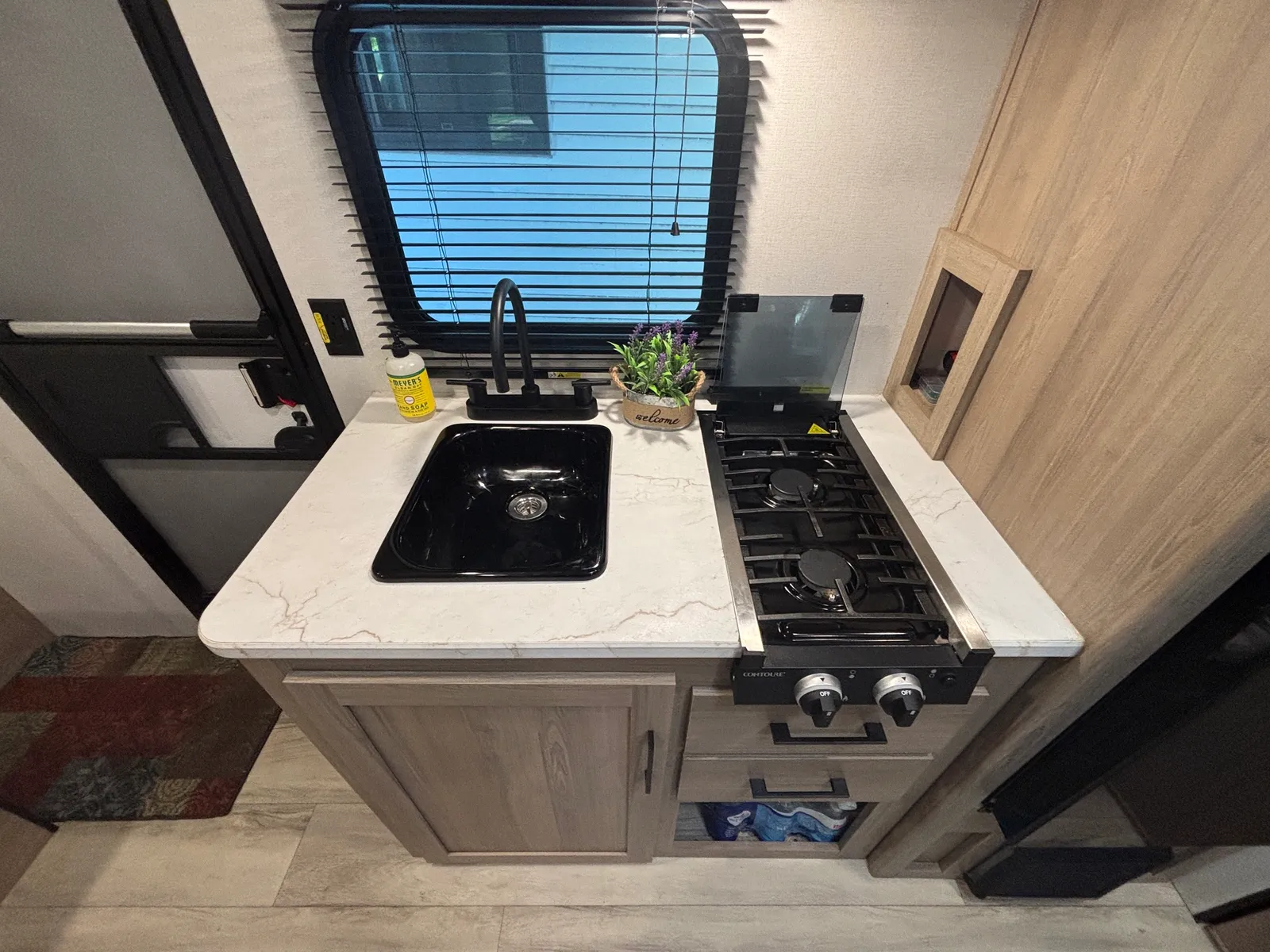 Countertop with the sink and gas cooktop