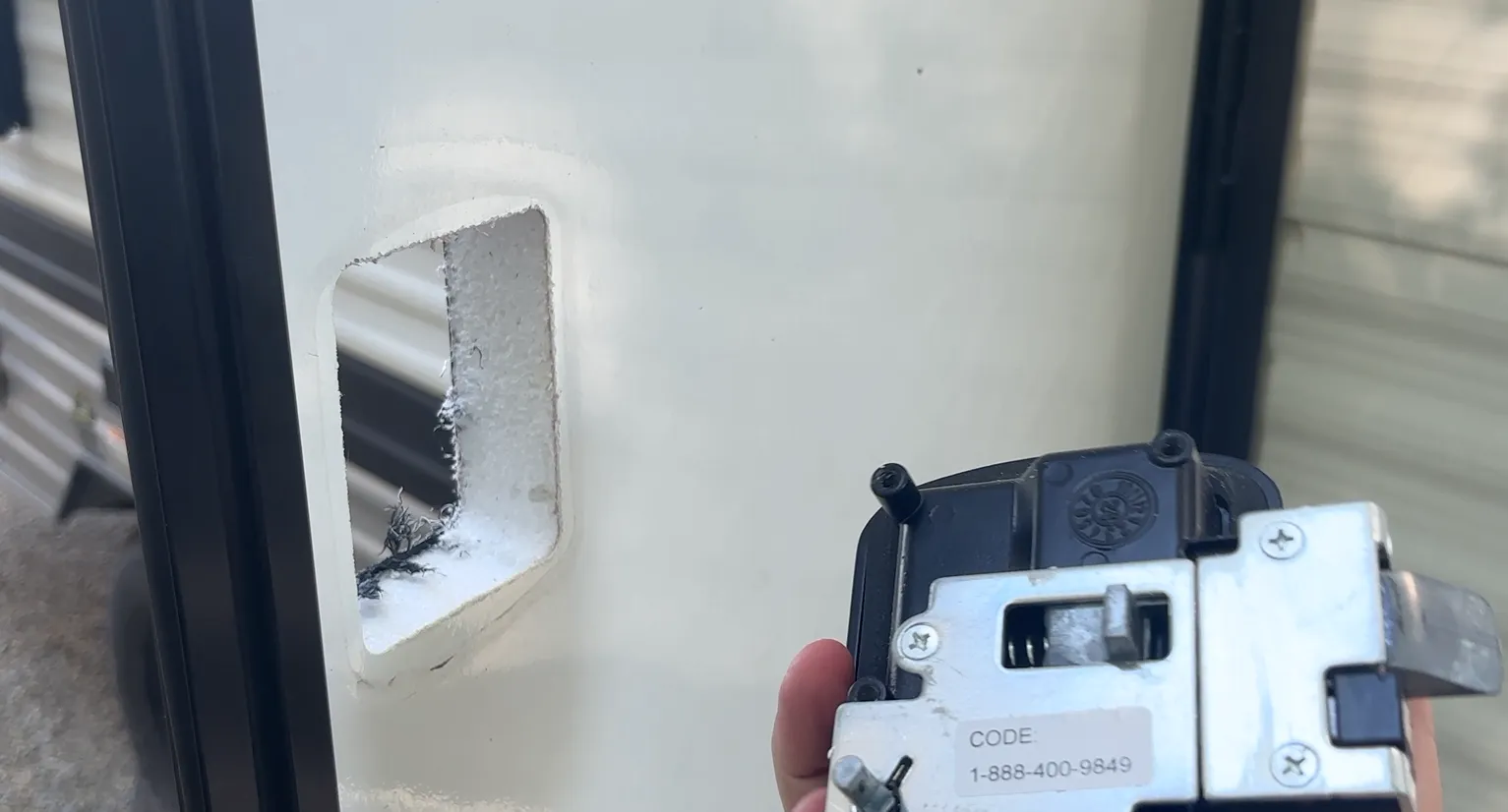 The factory lock removed, ready for the new handle